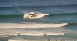 Passenger boat runs aground in high surf off Hawaii beach