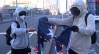 Shocking moment the Australian flag is set on fire during protest in support of Palestine