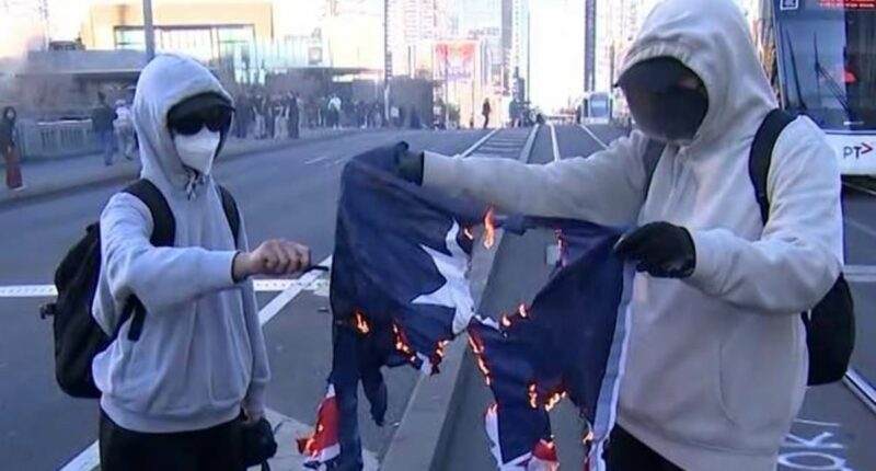 Shocking moment the Australian flag is set on fire during protest in support of Palestine