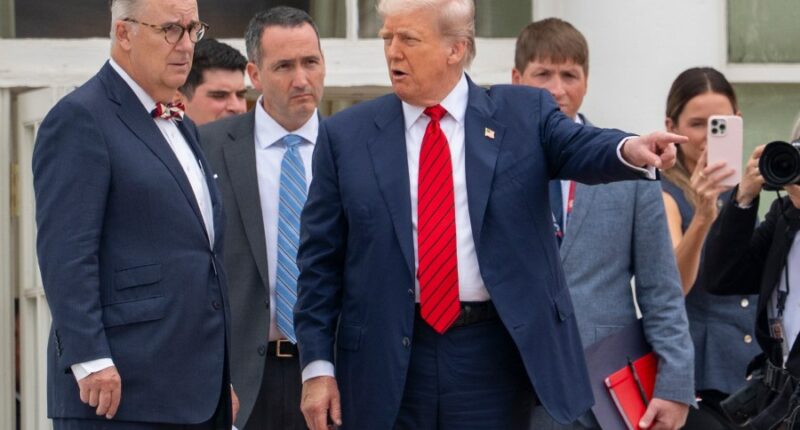 Trump takes an unexpected walk on the White House roof to survey new projects