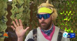 Man with blond hair and sunglasses speaks to camera about Bigfoot.