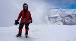 Natalia Nagovitsina, a Russian climber, on a snowy mountaintop.