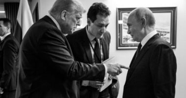 Black and white photo of Donald Trump pointing at Vladimir Putin.