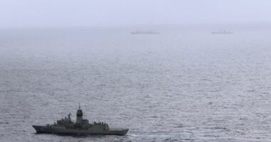 The HMAS Arunta, left, shadows the People's Liberation Army-Navy Jiangkai-class frigate Hengyang and a Fuchi-class replenishment vessel in the Tasman Sea, on Feb. 13, 2025.