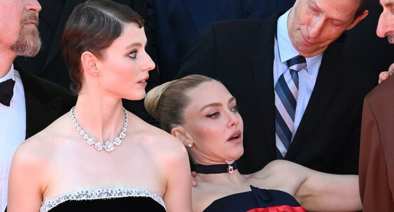 Amanda Seyfried suffers a tumble at The Testament of Ann Lee premiere