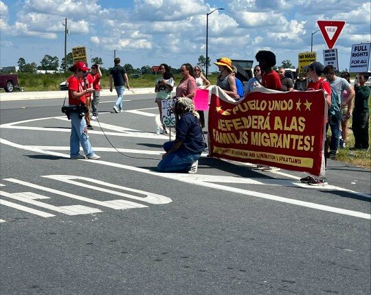 Anti-ICE protesters gather in front of Hyundai facility