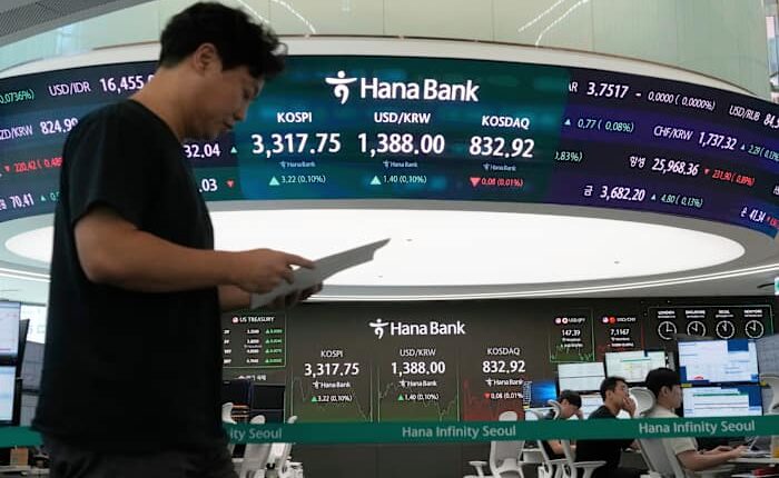 Asian shares are mostly up after US stocks inch to more records as inflation slows and Oracle soars