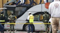 At least 8 dead as bus filled with people collides with train