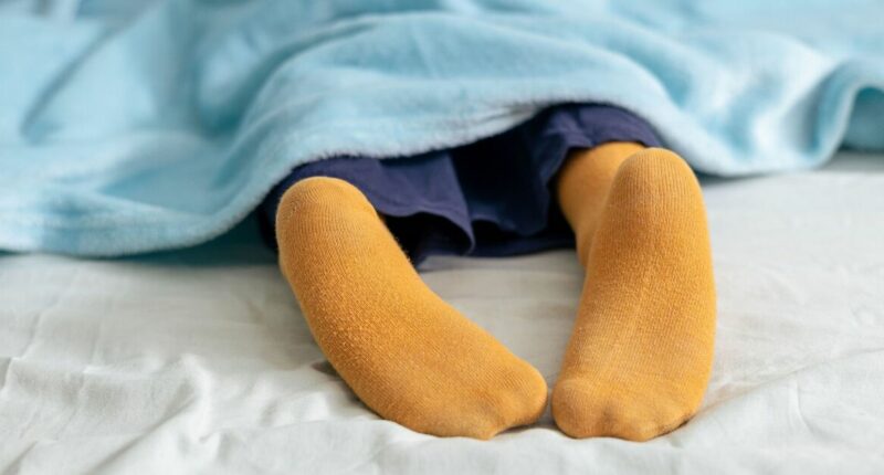 Brits issued warning over wearing socks to bed