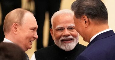 Car rides and hand holding: Putin, Modi and Xi send Trump a pointed message