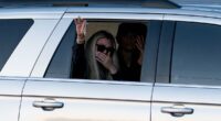Charlie Kirk's widow Erika waves to supporters on his final journey