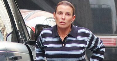 Coleen Rooney unbuttons her jeans after leaving Indian restaurant