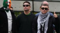 Liam Ã“g Ã“ hAnnaidh, aka Mo Chara, right, a member of the Irish language band Kneecap, celebrates as he leaves Woolwich Crown Court in London, Friday, Sept. 26, 2025, after Chief Magistrate, Senior District Judge Paul Goldspring, dismissed a terrorism offence relating to displaying a flag in support of Hezbollah during a performance with the band in November 2024, on a technical error.