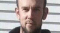 Tom Phillips, on the run from police with his three young children for almost four years, was found by police on Monday - before a fatal shoot-out in the dark ensued