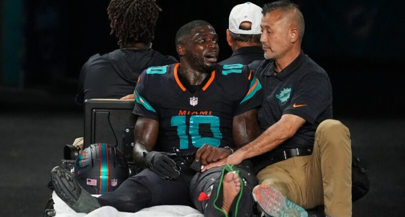 Dolphins' Tyreek Hill carted off field and taken to hospital with serious left leg injury
