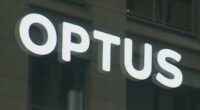 A close-up shot of an Optus store sign