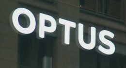 A close-up shot of an Optus store sign