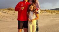 Pictured: Kim with her children Elijah and Willow on a beach in New Zealand after the family moved there in June