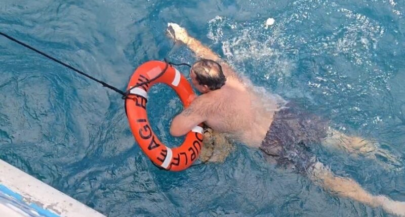 Fisherman is rescued after treading water for eight hours at sea, second fisherman remains missing