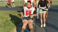 High school football player whose spine was fractured by rival returns