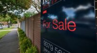 A for sale sign on a home.