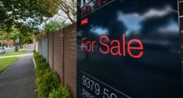 A for sale sign on a home.