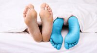 How to end the duvet wars! Medical experts reveal why women are always freezing cold while men feel boiling hot - and what you can do about it