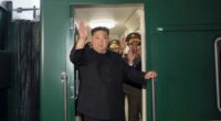 North Korea leader Kim Jong Un waves from a train in Pyongyang, North Korea.