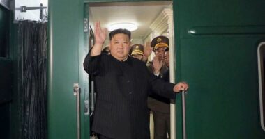 North Korea leader Kim Jong Un waves from a train in Pyongyang, North Korea.