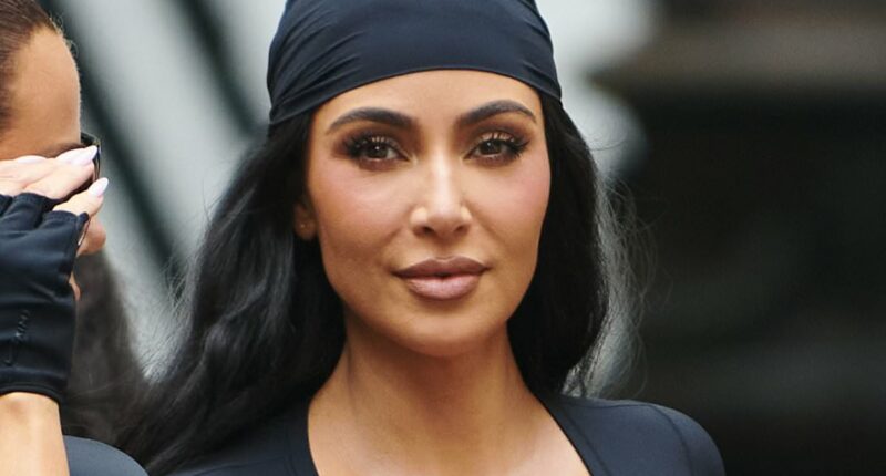 Kim Kardashian models a pirate look while flashing her tummy
