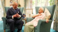 King Charles beams as he meets the world's oldest person, aged 116
