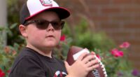 Local boy with rare genetic disorder throws first pitch at Akron Rubber Ducks game