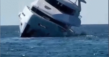 Luxury yacht tips and sinks minutes after launch as terrified passengers jump overboard