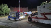 Ambulances are parked outside a hotel that is acting as a reunification center after a shooting at a country club in Nashua, New Hampshire.
