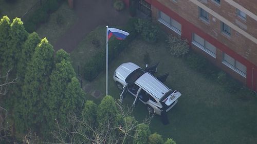 A Victorian man has been charged, accused of acting erratically at the Russian Consulate in Sydney's east before ploughing a car through the gates.