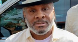 Bryan Hooper Sr. wearing dress shirt and hat