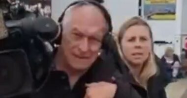 Moment BBC journalists are chased out of anti-migrant hotel protest