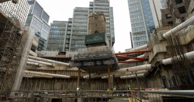 Moment historic London church is lifted 45 feet
