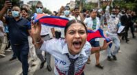 A demonstrator shouts slogans during a protest outside the Parliament in Kathmandu.