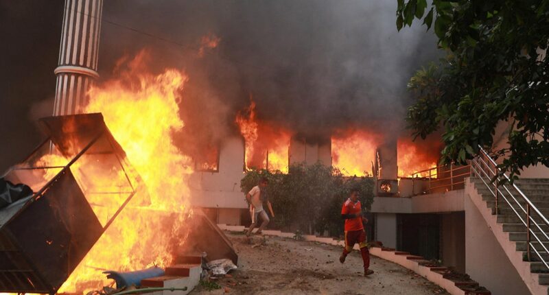 Nepal's prime minister resigns as rioters burn leaders' homes