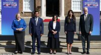Home Secretary Shabana Mahmood, centre, poses with U.S. Homeland Security Secretary Kristi Noem, Canada's Public Safety Minister Gary Anandasangaree, Australia's Home Affairs Minister Tony Burke and New Zealand's Attorney General Judith Collins at the opening of a "Five Eyes" security alliance summit in central London
