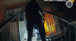 Dramatic vision has captured the moment police officers rescued an elderly couple, one of whom was in a wheelchair, and their grandson from flames that engulfed their home on the Gold Coast.