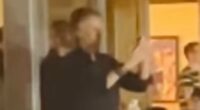 Paul McCartney is seen filming Oasis as he joins A-listers at gig