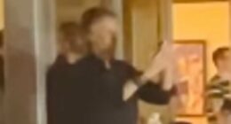 Paul McCartney is seen filming Oasis as he joins A-listers at gig