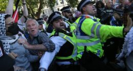 LONDON, ENGLAND - SEPTEMBER 6: Police officers scuffle with supporters as protesters are arrested during the protest in Parliament Square on September 6, 2025 in London, England. The UK Government will be able to challenge the decision to allow activist group Palestine Action's appeal against their proscription as a terrorist organisation. (Photo by Martin Pope/Getty Images)