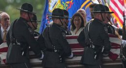 Police gather for the funeral of 3 Pennsylvania detectives ambushed by gunman