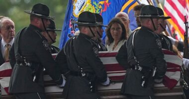 Police gather for the funeral of 3 Pennsylvania detectives ambushed by gunman