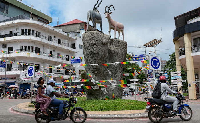 Polls open in Guinea in a referendum that could allow junta leader to run for president