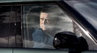 Prince Andrew appears pensive while driving around Windsor Castle