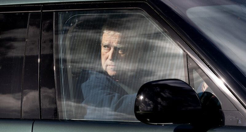 Prince Andrew appears pensive while driving around Windsor Castle